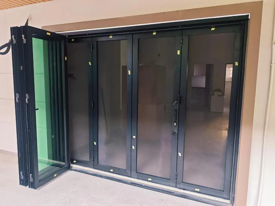 Windows & Doors 5 Wide aluminium folding glass doors opened towards the side of a residential space
