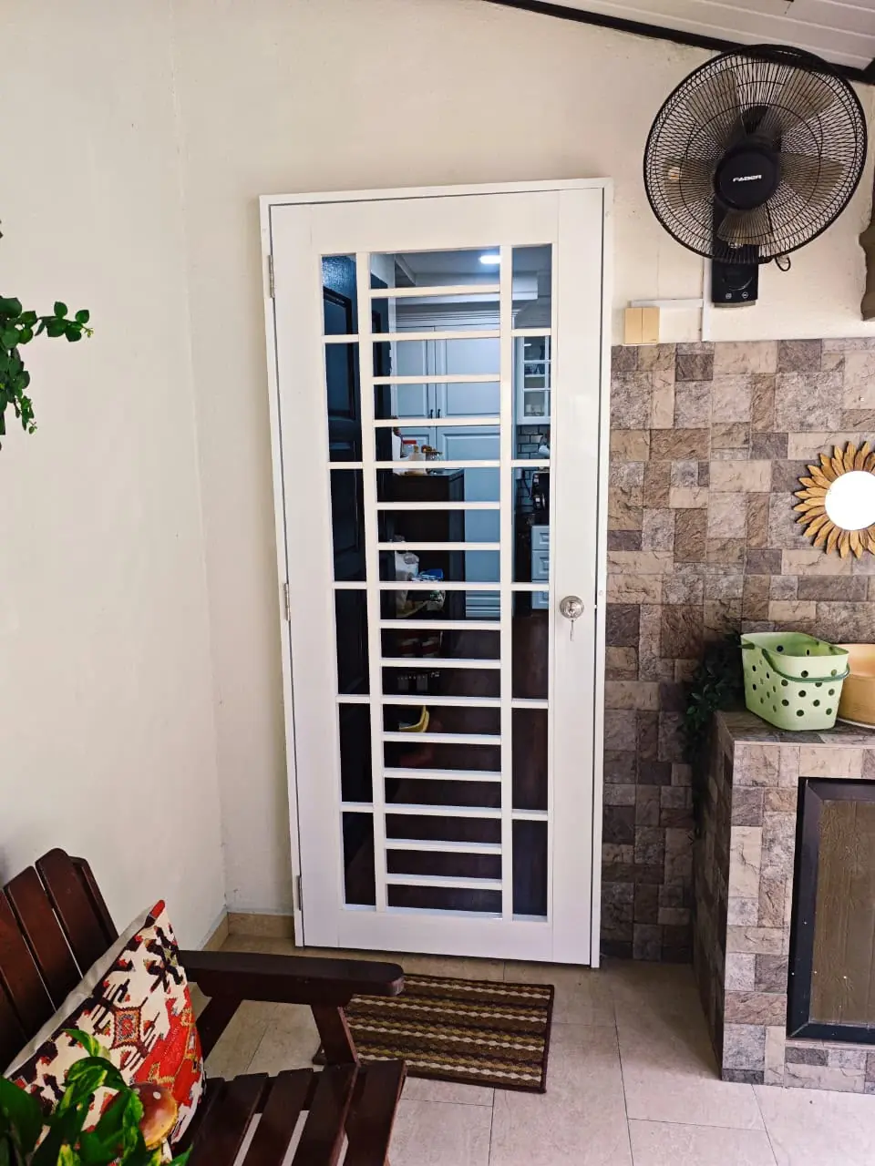 Windows & Doors 6 Close view of an aluminium security mesh door and grille frame installed at a home